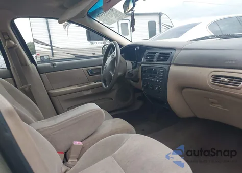 2001 Ford Taurus Ses z USA, uszkodzony, nr VIN 1FAFP55201G227894